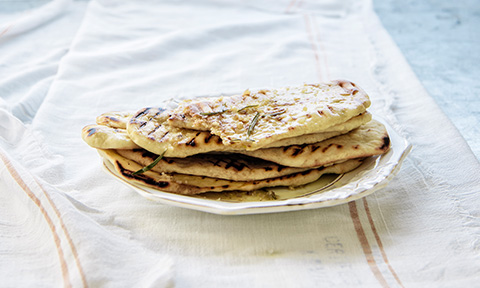 Grilled flatbread on a dish.