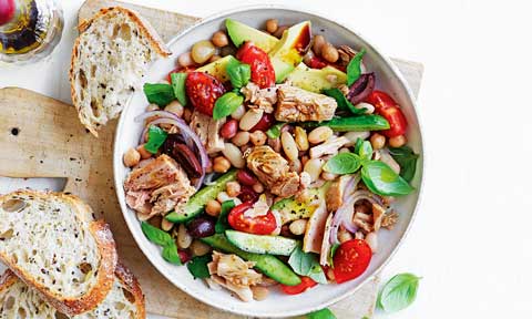 Tuna and bean salad in a bowl served with crusty bread