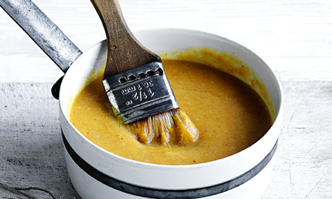 Peach and rum glaze in a saucepan