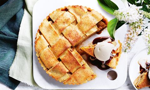 A salted caramel apple pie served with ice cream