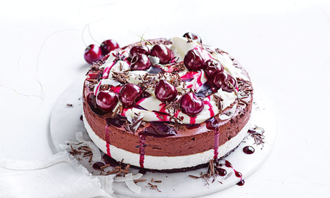 Chocolate and cherry mousse cake on a dish.