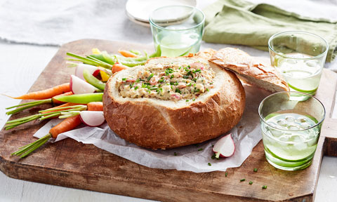 French onion, bacon and cheese mixture in a cob loaf