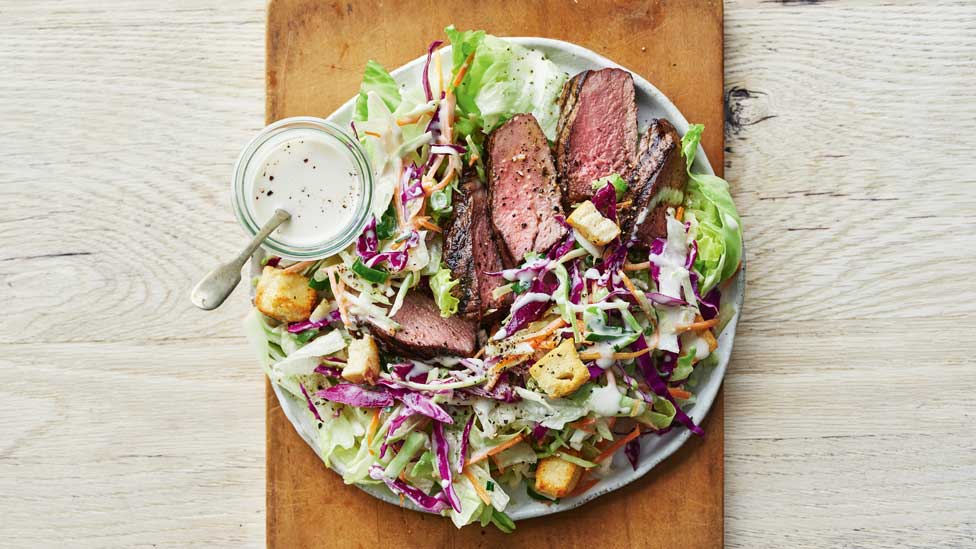 Steak with salad and blue cheese dressing