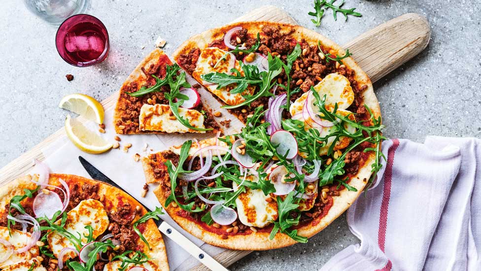 Spiced lamb and halloumi pizzas