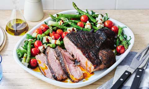 Smokey BBQ lamb with grilled tomato and asparagus salad