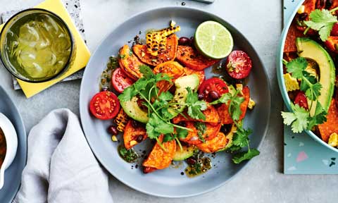 Sweet potato salad with black beans and corn cobs