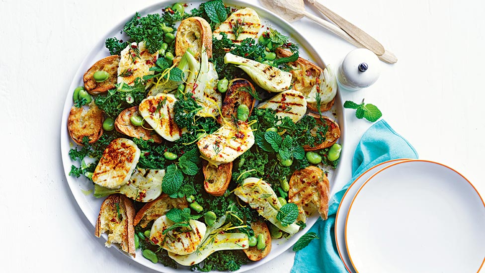BBQ haloumi mixture and fennel panzanella salad on a plate