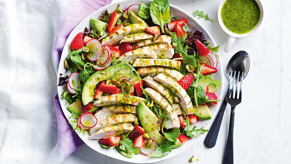 Bbq chicken salad with avocado, strawberries and radish 