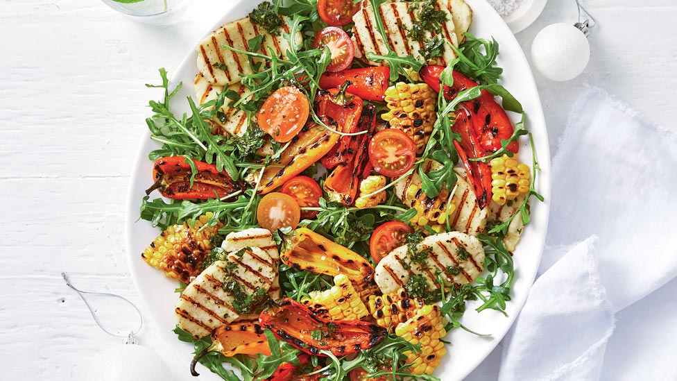 BBQ haloumi, corn and capsicum salad on a platter