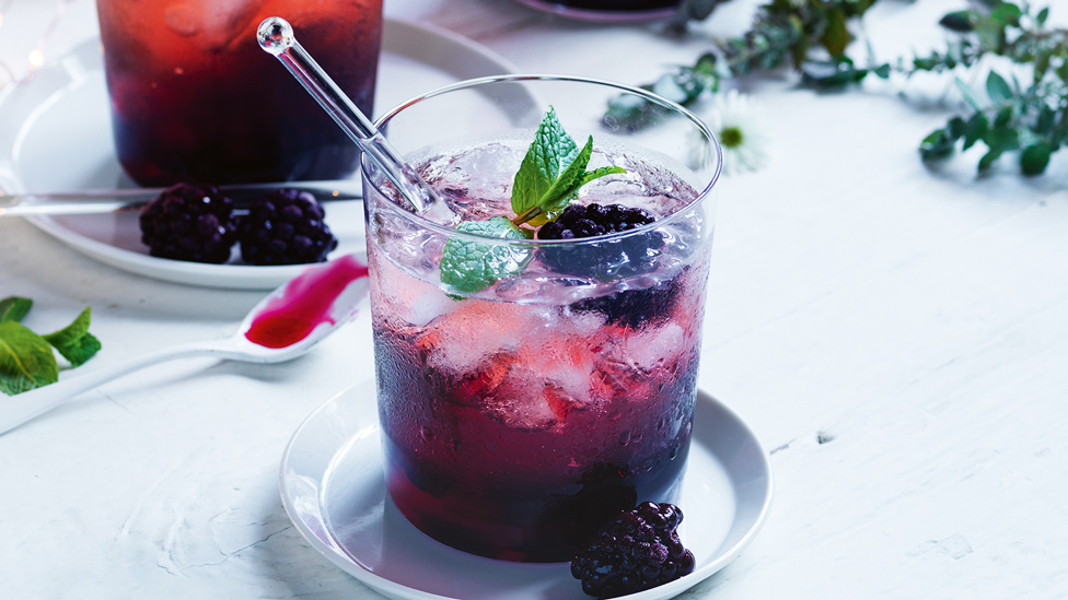 Blackberry star anise and rose sangria with mint sprigs