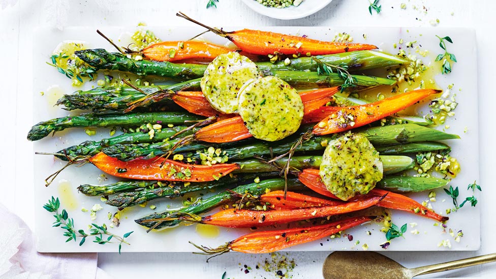 Carrot and asparagus with pistachio butter on a platter