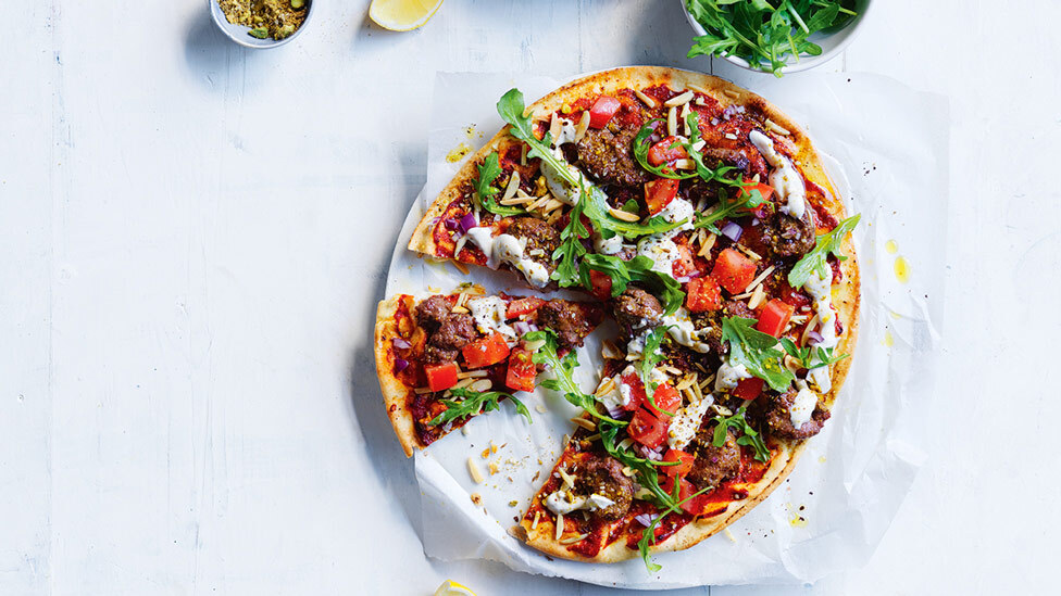 Moroccan-style beef pizzas cut in wedges