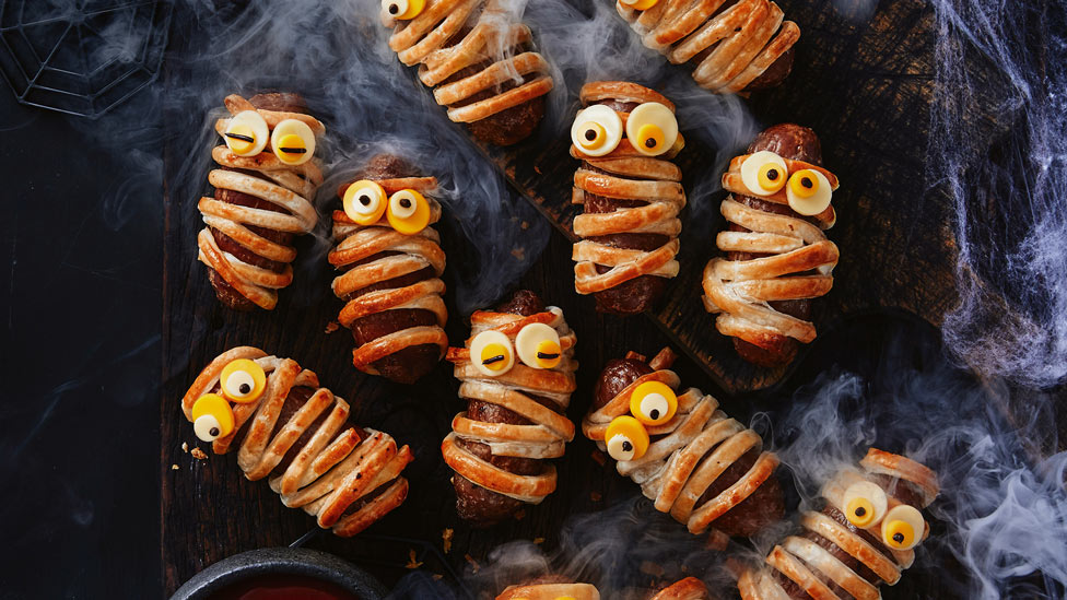 Nine mummy sausage rolls