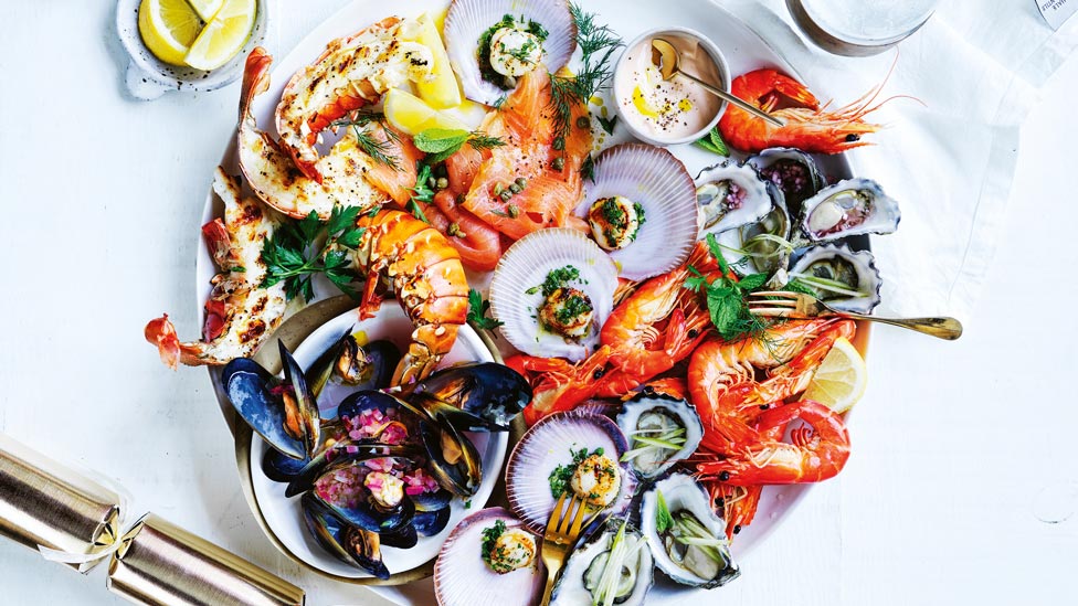 A must-try seafood platter with lobster, scallops, mussels, mignonette and apple cider dressing