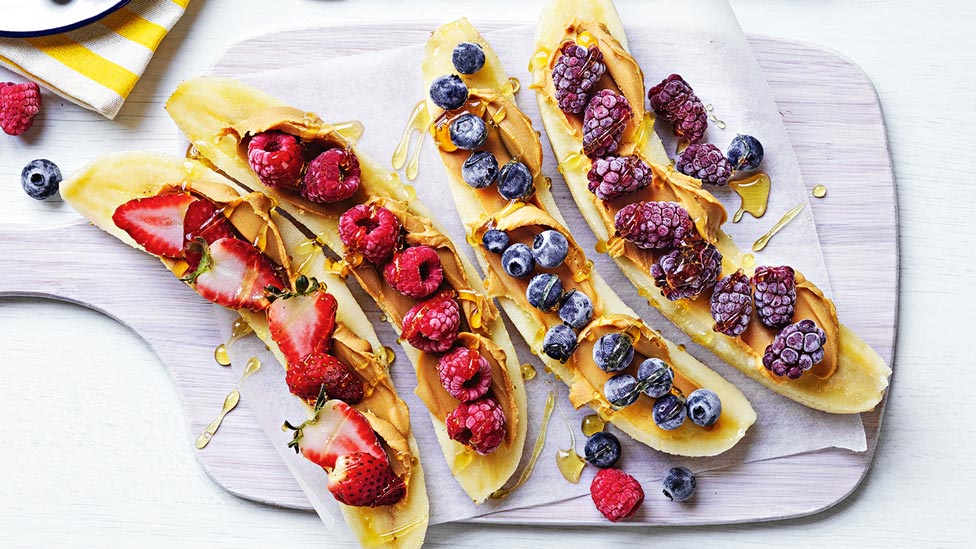 Peanut butter and berry on four frozen bananas