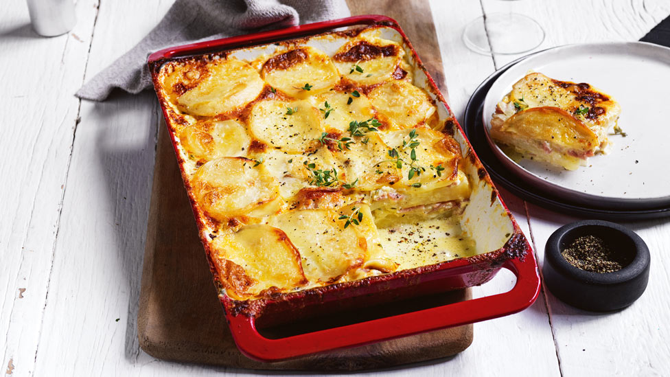 Ham and leek potato gratin in baking dish