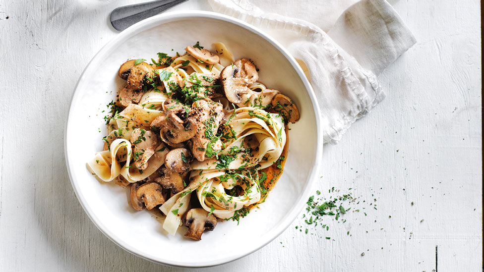 Slow cooker chicken stroganoff sprinkled with parsely