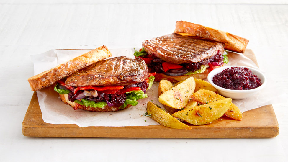 Steak sandwich with beetroot relish and wedges