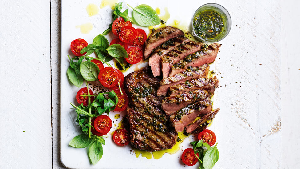 Thick cuts of steaks with pistachio pesto