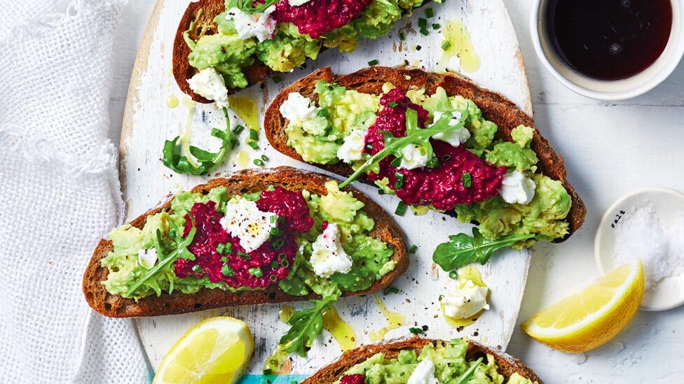 Three new avo toasts with chive and rocket leaves