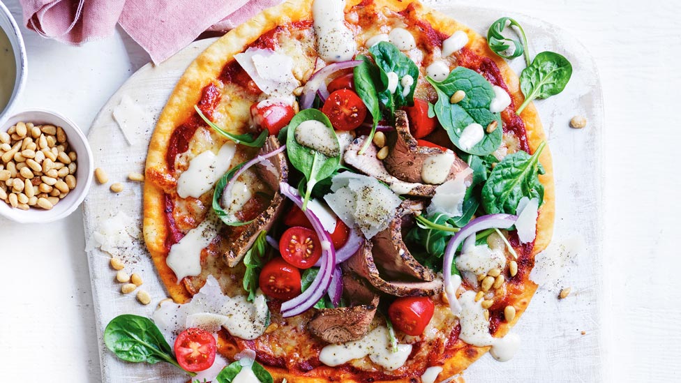 Bbq lamb pizza with spinach and ceasar dressing
