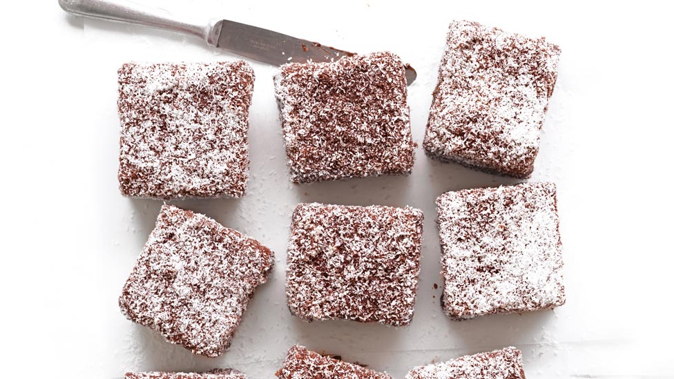 8 chocolate lamingtons on the kitchen bench