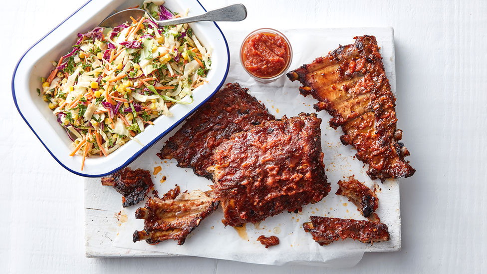 Southern BBQ pork ribs with sauce and salad