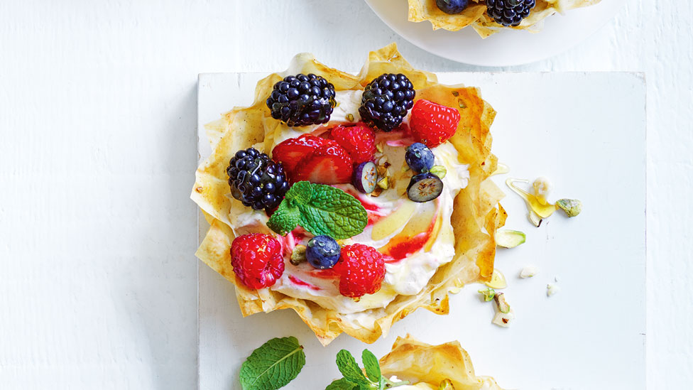 Baklava tart with blueberries, strawberries and blackberries topping