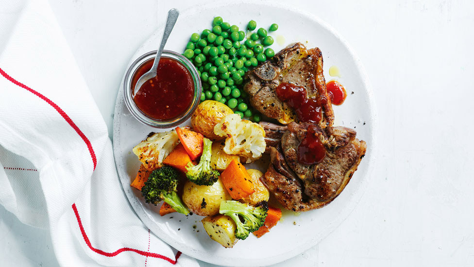 Roasted lamb dish with vegetables, peas and tomato chutney
