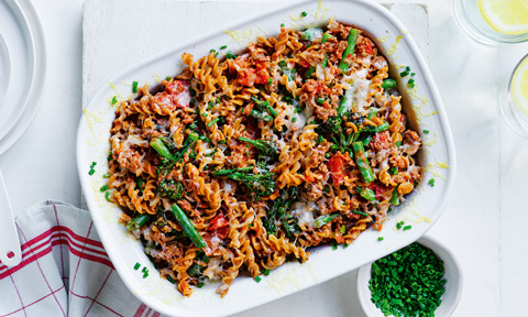 Beef and green veggie pasta bake sprinkled with chives