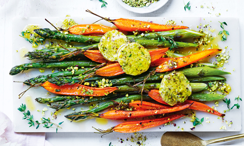 Carrot and asparagus with pistachio butter on a platter