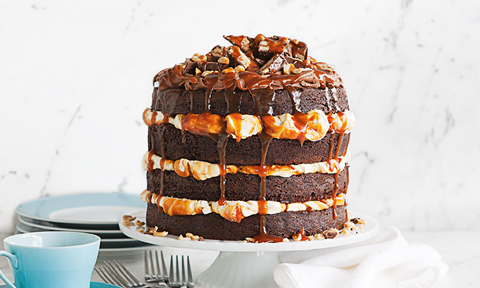 Chocolate snicker cake topped with addition snickers