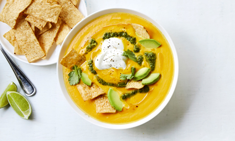 Mexican-style pumpkin soup topped with broken corn chips and coriander