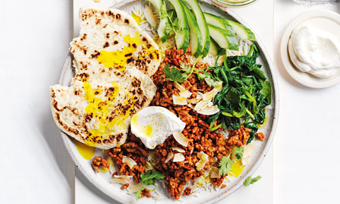 Tandoori lamb with rice, naan, cucumber and spinach