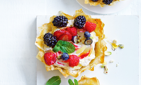 Baklava tart with blueberries, strawberries and blackberries topping