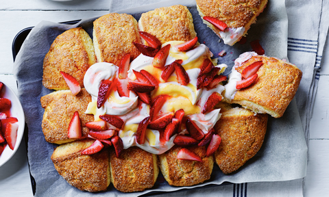 Buttermilk scones with lemon curd and strawberries on top