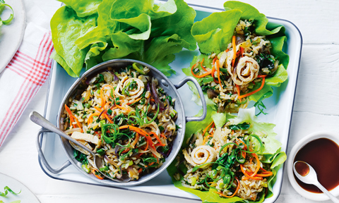 Two fried rice lettuce cups with fried rice and lettuce