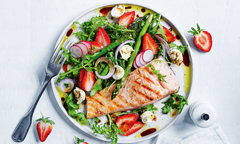 A dish of strawberry and asparagus salad with salmon