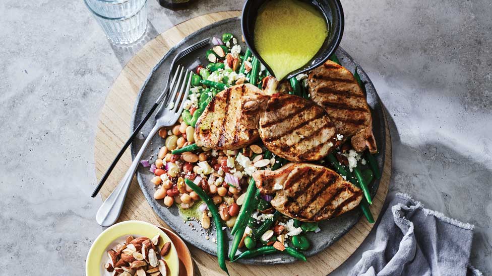 Pork steaks with mixed bean salad