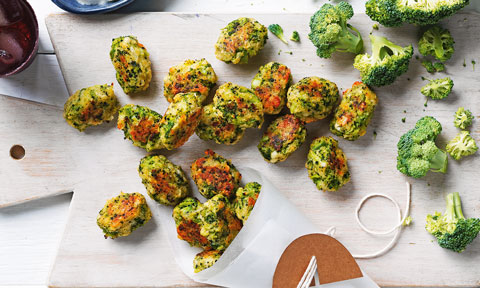 Broc tots served on a chopping board with fresh broccoli on the side