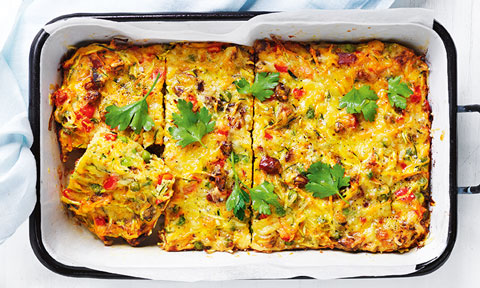 Chorizo and zucchini slice served a baking dish with coriander on top