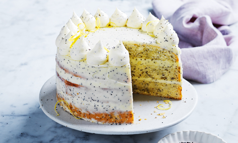 Whole lemon and poppy seed cake with a slice cut out
