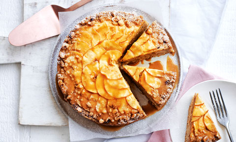 Apple cake served on plate and cut into three slices 