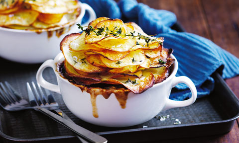 Two beef and beer pies with potato on top