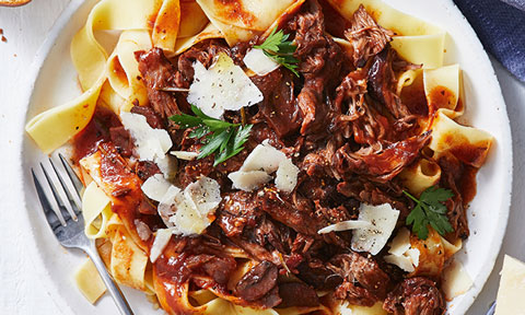 Lamb shank ragu served on pappardelle with shaved parmesan and flat leaf parsley