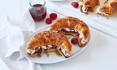 Two Ricotta Raspberry Croissant French Toast on White Plate