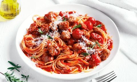 Sausages served in spaghetti sauce with rosemary and parmesan cheese 