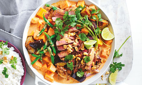 One-pot Massaman Beef Curry garnished with peanuts and lime, served with jasmine rice