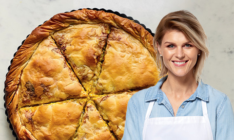 Greek chicken pie with a picture of Courtney Roulston over the top