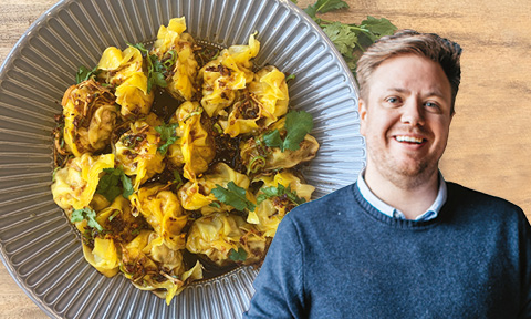 Pork and prawn pot sticker dumplings in a bowl with coriander and chilli sauce with picture of Michael Weldon over the top